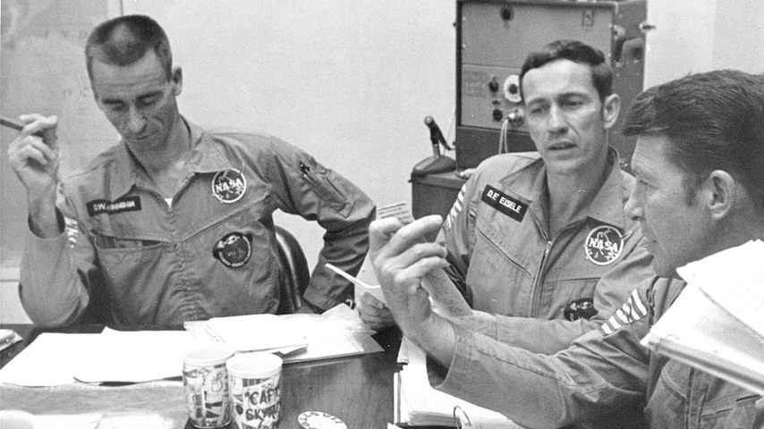 Astronauts during the Apollo 7 debriefing.